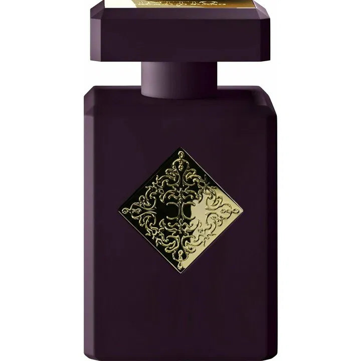 Dark purple perfume bottle with gold decorative label on a white background